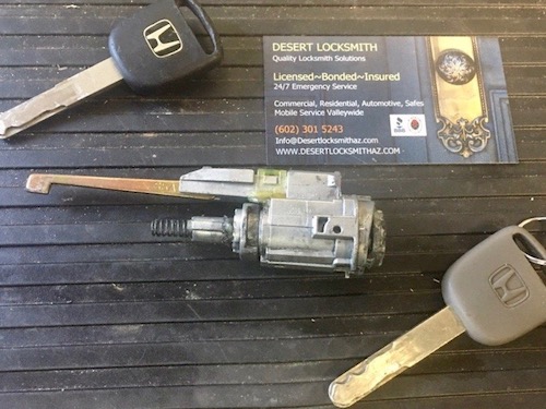 Honda car key and ignition on table