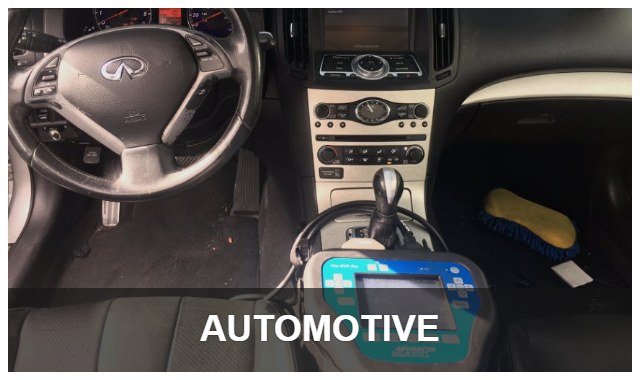 Programming a new car key on site with a key programmer plugged into the car