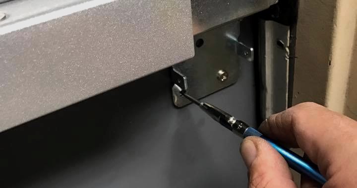 Desert Locksmith adjusting a commercial door closer